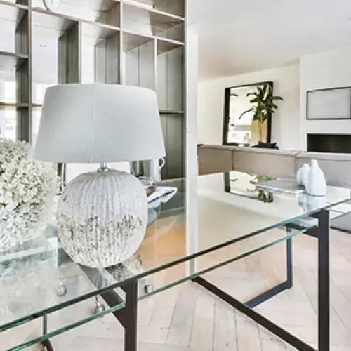 Custom glass tabletop protecting a wood table